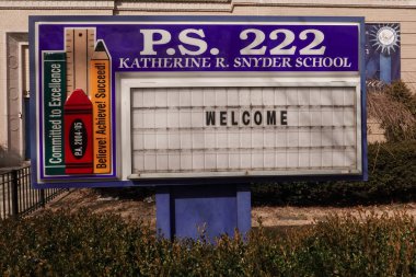 BROOKLYN, NEW YORK - FEBRUARY 25, 2021: Elementary school P.S. 222 welcomes students in Brooklyn, NY. New York closed down the public school system. Elementary Schools reopened on December 7th, 2020 clipart