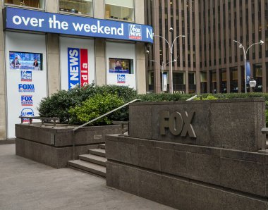 NEW YORK - MARCH 25, 2021: Fox News sign at the News Corporation headquarters building in New York City. News Corporation is an American diversified multinational mass media corporation  clipart