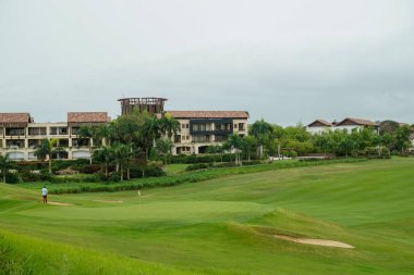 LA ROMANA, DOMINICAN REPUBLIC - JUNE 11, 2021: World famous Dye Fore Golf Course of Casa de Campo. Oceanside golf course with 27 holes, including cliff side holes dropping to the Chavon River below clipart