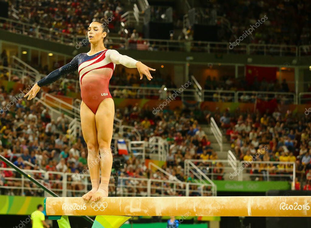 RIO DE JANEIRO, BRAZIL - AUGUST 9, 2016: Olympic champion Aly Raisman of United States competing on the balance beam at women's all-around gymnastics at Rio 2016 Olympic Games