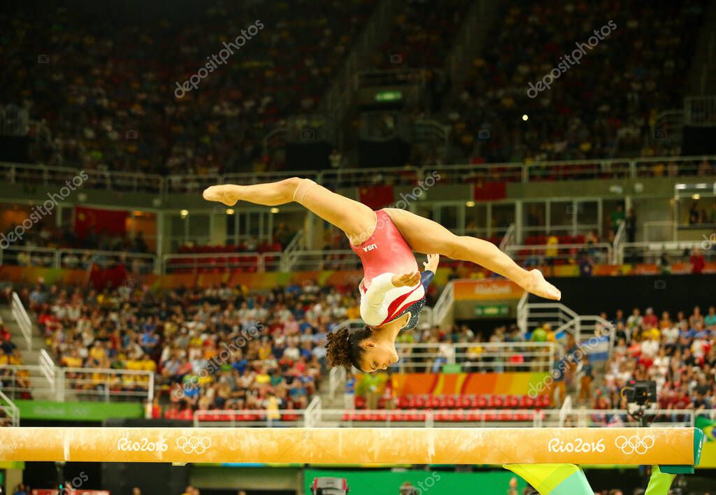 RIO DE JANEIRO, BRAZIL - AUGUST 9, 2016: Olympic champion Laurie Hernandez of United States competing on the balance beam at women's all-around gymnastics at Rio 2016 Olympic Games