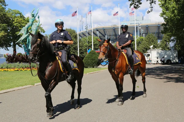 NYPD police officers on horseback ready to protect public at Billie Jean King National Tennis Center during US Open 2014 — Stock Photo, Image