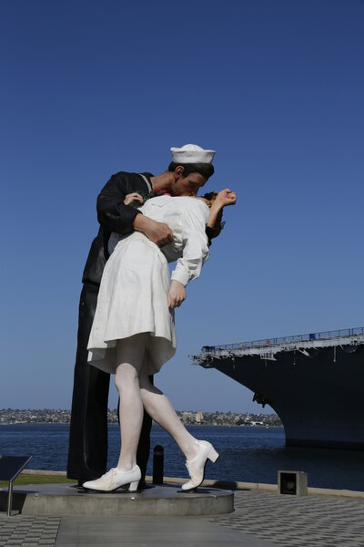 The Unconditional Surrender sculpture by Seward Johnson in the front of USS Midway in San Diego