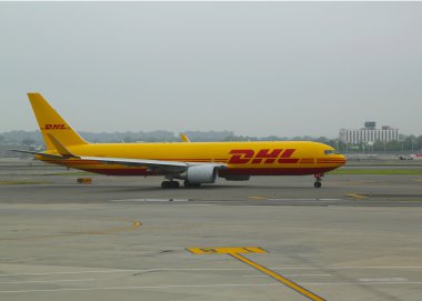 DHL Air Boeing 767 aircraft taxing at John F Kennedy International Airport in New York clipart