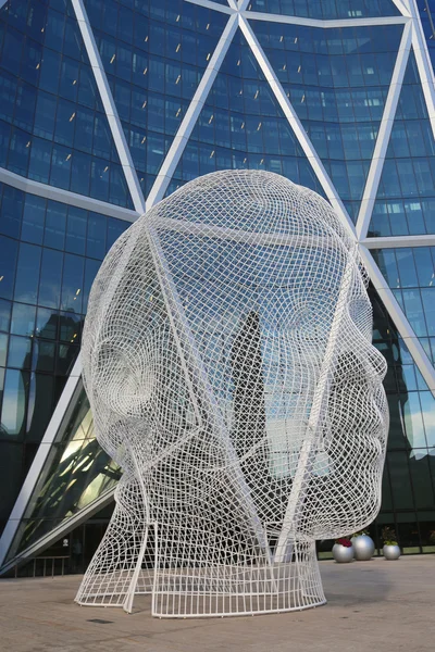 Wonderland sculpture by Jaume Plensa in the front of the Bow Tower in Calgary — Stock Photo, Image