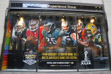 NBC Experience Store window display decorated with NFL and Super Bowl XLIX logos in Rockefeller Center clipart