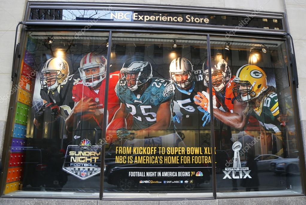 NEW YORK - DECEMBER 18: NBC Experience Store window display decorated with NFL and Super Bowl XLIX logos in Rockefeller Center in Midtown Manhattan on December 18, 2014