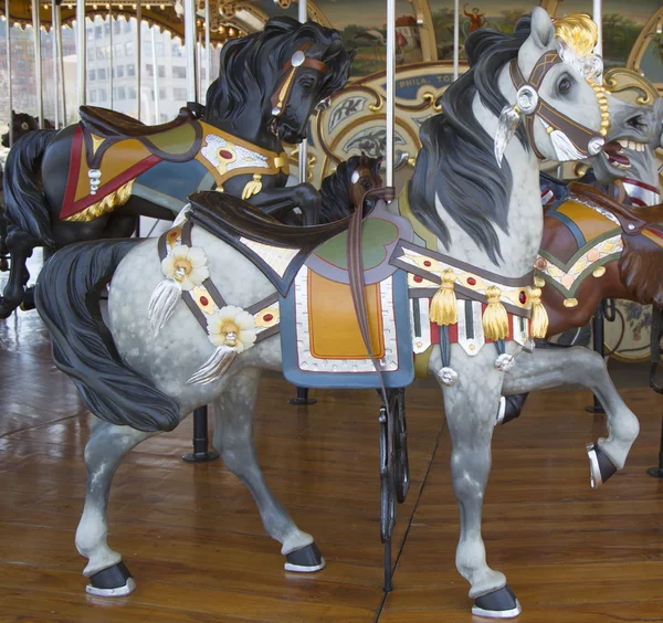 Horses on a traditional fairground Jane's carousel in Brooklyn — Stock Photo, Image