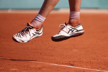 Professional tennis player Richard Gasquet of France wears custom Asics Gel Resolution shoes during his third round match at Roland Garros