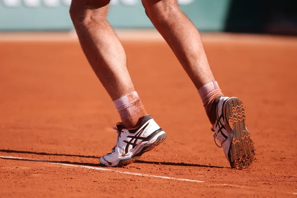 Professional tennis player Richard Gasquet of France wears custom Asics Gel Resolution shoes during his third round match at Roland Garros — Zdjęcie stockowe