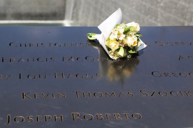Flowers left at the National September 11  Memorial at Ground Zero in Lower Manhattan