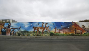 Mural art inspired by Patagonian history near Strait of Magellan ferry at Bahia Azul, Chile