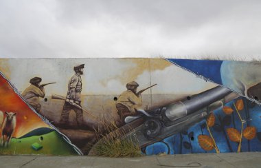 Mural art inspired by Patagonian history near Strait of Magellan ferry at Bahia Azul, Chile