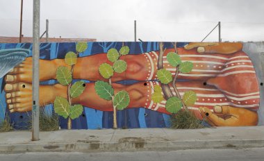 Mural art inspired by Patagonian history near Strait of Magellan ferry at Bahia Azul, Chile