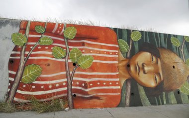 Mural art inspired by Patagonian history near Strait of Magellan ferry at Bahia Azul, Chile