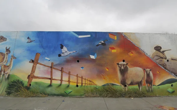 Mural art inspired by Patagonian history near Strait of Magellan ferry at Bahia Azul, Chile