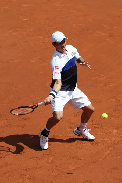 Professional tennis player Kei Nishikori of Japan during second round match at Roland Garros 2015 — Stok fotoğraf