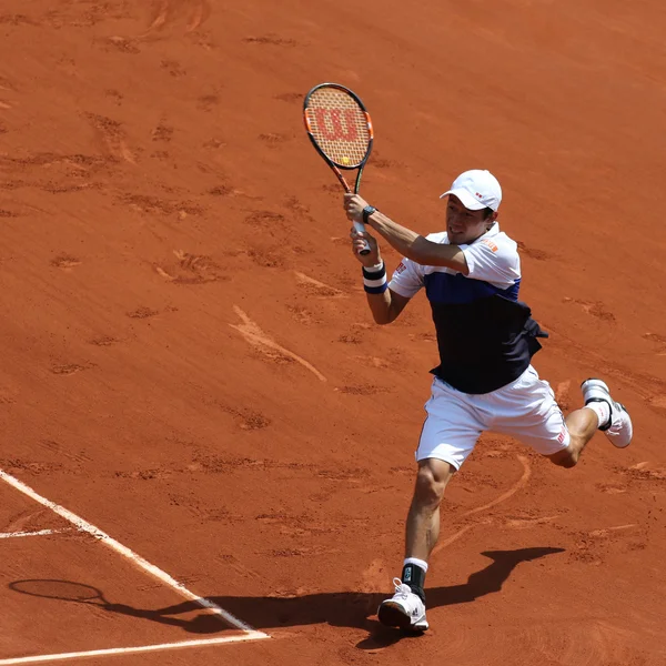 Professional tennis player Kei Nishikori of Japan during second round match at Roland Garros 2015 — ストック写真