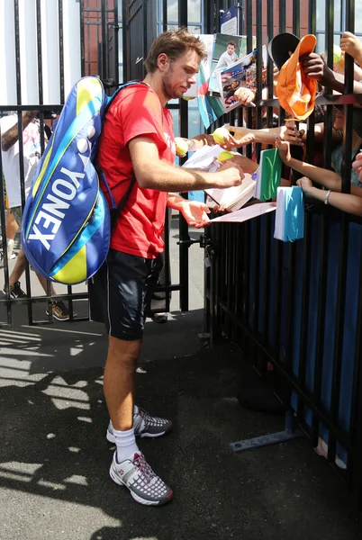 Two times Grand Slam champion Stanislas Wawrinka of Switzerland signing autographs after practice — стокове фото