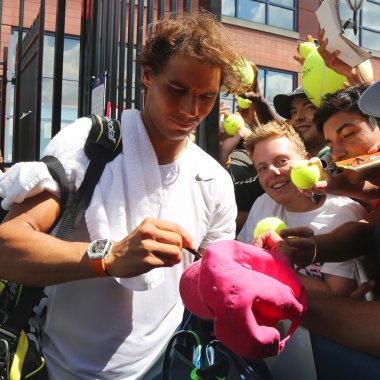 Fourteen times Grand Slam champion Rafael Nadal of Spain signing autographs after practice for US Open 2015 clipart
