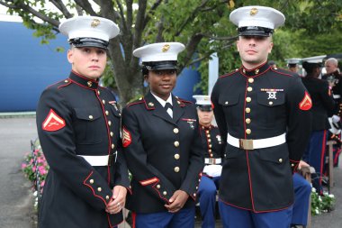 United States Marine Corps officers at Billie Jean King National Tennis Center before unfurling the American flag prior US Open 2015 men's fina