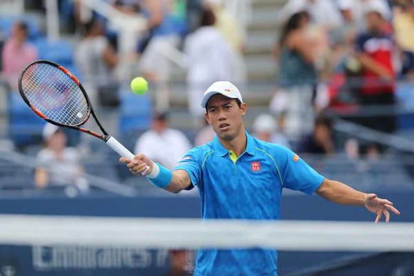 Professional tennis player Kei Nishikori of Japan in action during first round match at US Open 2015 — Zdjęcie stockowe