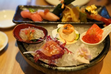 Omakase style high quality sashimi platter served on a bad of ice in Japanese restaurant
