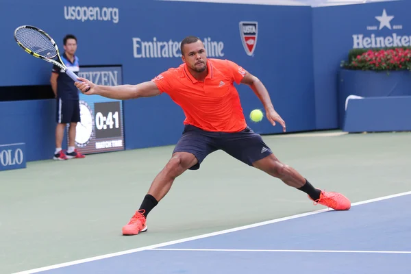 Professional tennis player Jo-Wilfried Tsonga of France in action during his quarterfinal match at US Open 2015 — Stock fotografie