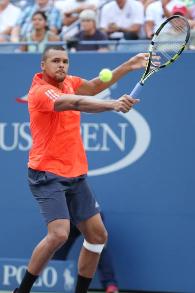 Professional tennis player Jo-Wilfried Tsonga of France in action during his quarterfinal match at US Open 2015 — Stock fotografie