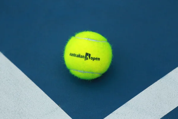 Wilson tennis ball with Australian Open logo on tennis court — Stok fotoğraf