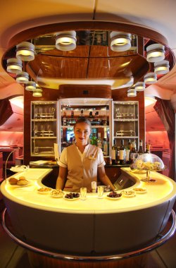 Emirates Airbus A380 in flight cocktail bar and lounge clipart