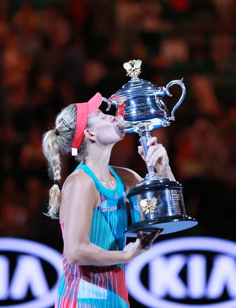 Grand Slam champion Angelique Kerber of Germany holding Australian Open trophy during trophy presentation after victory at Australian Open 2016 — ストック写真