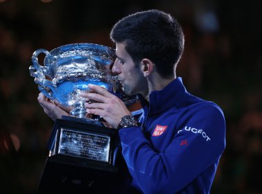 Grand Slam champion Novak Djokovic of Sebia holding Australian Open trophy during trophy presentation after victory at Australian Open 2016