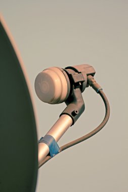 Signal receiver of Dish antenna of a television set on a building terrace, Pune, Maharashtra, India