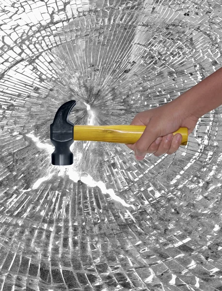 Hammer in Human Hand hitting Glass — Stock Photo, Image