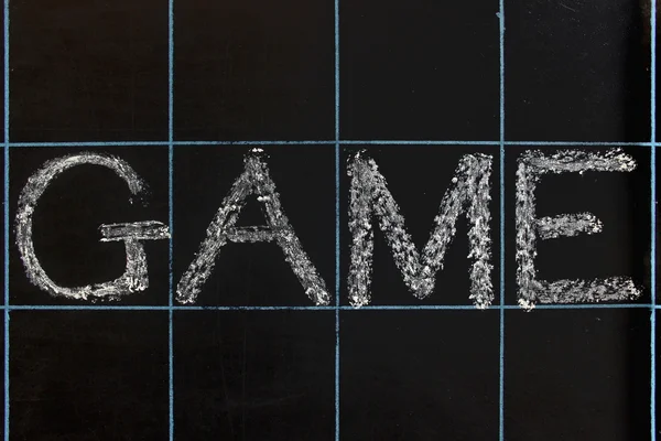Spielwort handgeschrieben auf schwarzer Tafel — Stockfoto