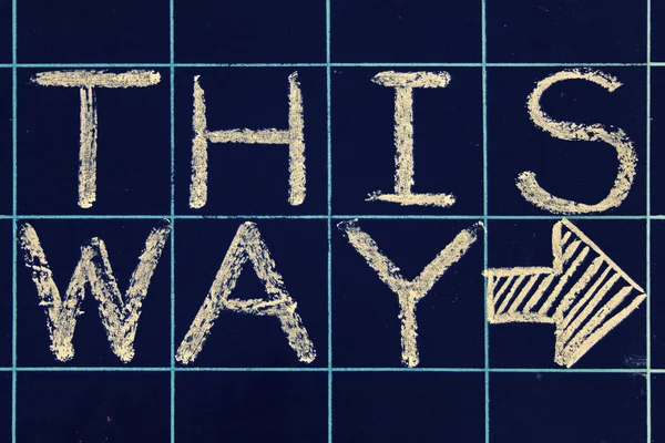 This way phrase handwritten on black chalkboard — Stock Photo, Image