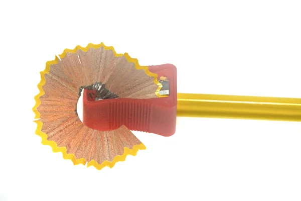 Pencil with sharpener and Pencil shavings — Stock Photo, Image