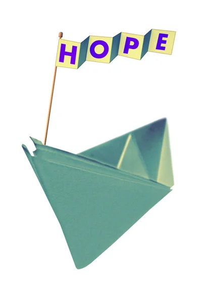 Łódź papieru origami z flagą pisania nadziei — Zdjęcie stockowe