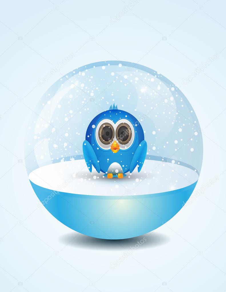 Cute bird inside snow dome