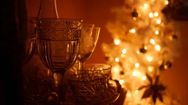 Alcoholic Beverage Glasses near Christmas Tree