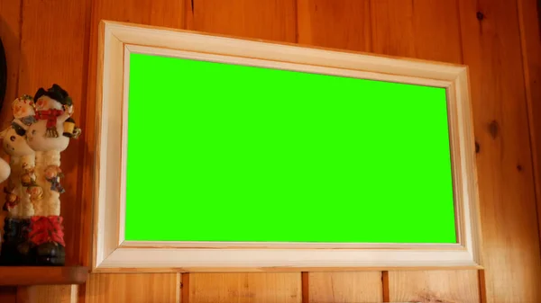 Green Screen Picture frame on Wooden Wall in Winter