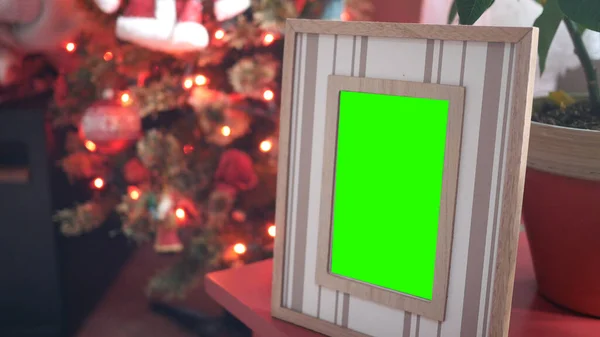 A Wooden Photo Frame with Red Christmas Lights in BG