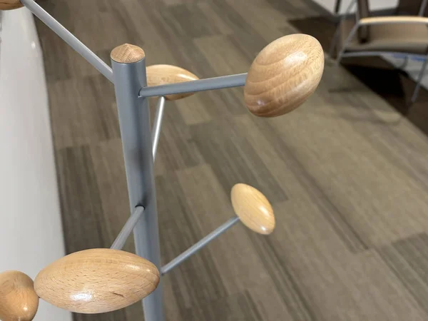 A Modern Coatrack in Corporate Hallway