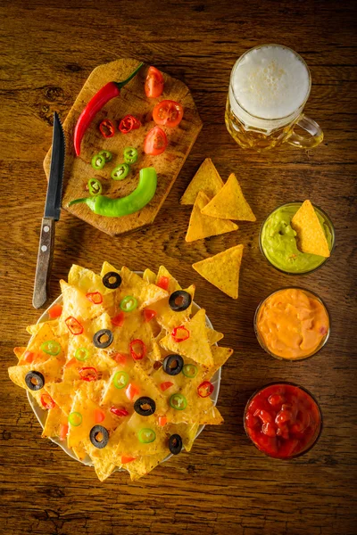 Nachos with dip and beer — Stock Photo, Image