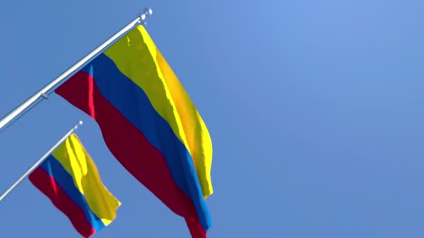 The national flag of Colombia is flying in the wind against a blue sky — Stock Video