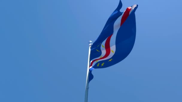 The national flag of Cape Verde is flying in the wind against a blue sky — Stock Video