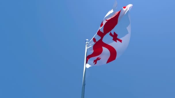 De nationale vlag van Georgië wappert in de wind tegen een blauwe lucht — Stockvideo