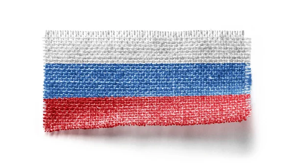 Russia flag on a piece of cloth on a white background — Stock Photo, Image