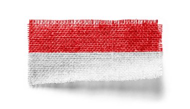 Beyaz arka planda bir kumaş parçasında Endonezya bayrağı